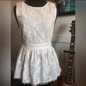 Forever that girl. White criss cross embroidered tank.‎ NWT